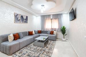 a living room with a couch and a table at Sahoria Stay in Dakhla