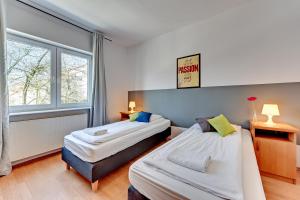 Posteľ alebo postele v izbe v ubytovaní Nice Rooms - Pokoje Gościnne