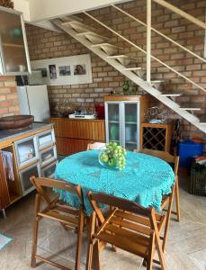 a kitchen with a table with a bowl of fruit on it at Estação Serrana in Pedro II