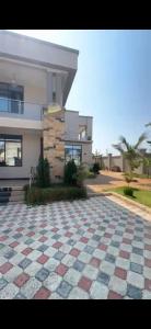 a checkered floor in front of a house at Rj Executive Apartments in Dodoma