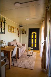 a living room with a couch and a table at Casa Dunja Čačak in Čačak
