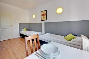 Posteľ alebo postele v izbe v ubytovaní Nice Rooms - Pokoje Gościnne