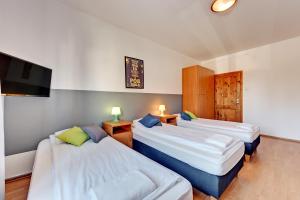 Posteľ alebo postele v izbe v ubytovaní Nice Rooms - Pokoje Gościnne