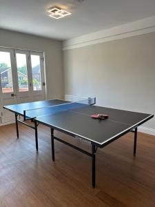 a ping pong table in the middle of a room at Cavendish Hotel in High Wycombe +33 photos