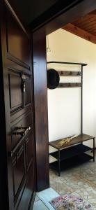 a room with a closet with a wooden door at TheA Upper Blue in Kyparissia