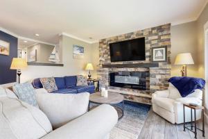 a living room with a couch and a fireplace at Anchorage 7473 in Hilton Head Island