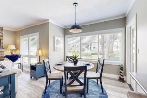 a kitchen and dining room with a table and chairs at Anchorage 7473 in Hilton Head Island