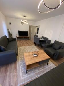 a living room with couches and a coffee table at Gashi Home in Prizren