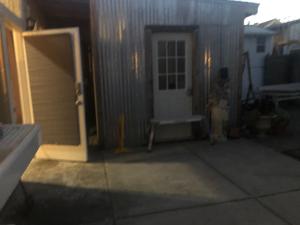 an outside view of a house with a door at Cottage bed 4 at FacesOasis in Oakland