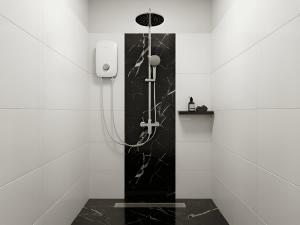 a bathroom with a shower with black and white tiles at Zen Cove Villa - 5-Min Walk to Zen Beach, Srithanu in Haad Chao Phao +5 photos