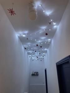 a room with a white ceiling with lights on it at L'Una Dimora in Certaldo +28 photos