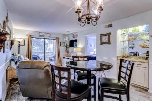 a kitchen and dining room with a table and chairs at Fiddlers Cove 18B in Hilton Head Island