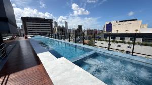 a swimming pool on the roof of a building at Acqua Tambaú Luxury Flat 100 meters from the sea in João Pessoa