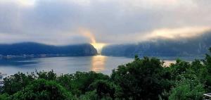 a rainbow in the middle of a body of water at DiBosco House in Dubova
