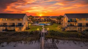 an aerial view of a resort at sunset at St Augustine Beachfront Condo with Ocean Views in Saint Augustine Beach