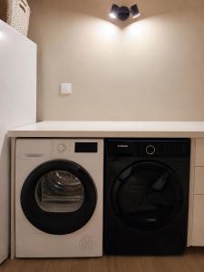 a washer and dryer under a counter in a room at Le Mas d'Elio in Cheval-Blanc +7 photos
