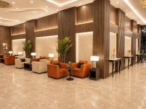 a lobby with couches and chairs in a building at فندق فصل الصيف امان - المنسك in Abha