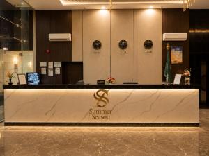 a lobby with a reception desk in a building at فندق فصل الصيف امان - المنسك in Abha +34 photos