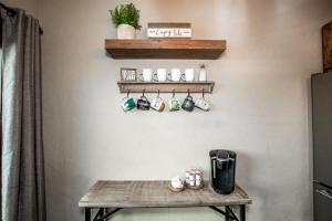 a room with a wooden table and shelves on the wall at Cana Loft 302 in Whitefish +11 photos