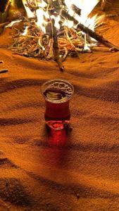 a glass cup in the middle of the desert at The Martian Bubbles - Wadi Rum in Wadi Rum +51 photos