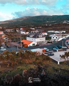 an aerial view of a town with a parking lot at Entre Mar e Vinhas RRAL Nº5668 in Biscoitos