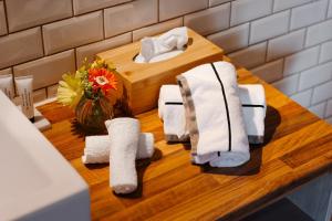 a bathroom with towels on a counter with a sink at Boutique Hotel Het Zoete Zijn in Borgloon +176 photos
