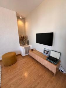 a living room with a flat screen tv on a wall at Apartamento Carmen in Macastre