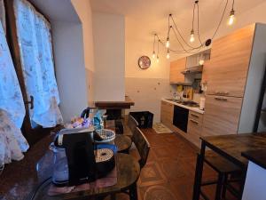 a kitchen with a table and a dining room at Il Casaletto di Simeone in Amelia