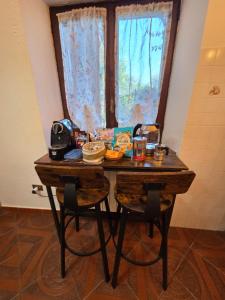 a table with food on it in front of a window at Il Casaletto di Simeone in Amelia