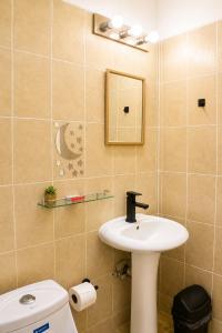 a bathroom with a sink and a toilet at Casa Esperanza in Playa Estacahuite