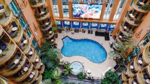 an overhead view of a swimming pool in a building at Hôtel Palace Royal Centre-Ville Québec par JARO in Quebec City