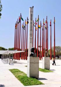 a bunch of flags in front of a monument at Hotel Boutique Trinitarias in Valledupar +6 photos