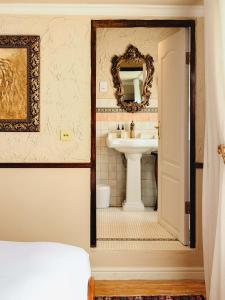 a bathroom with a sink and a mirror at Royva Bo-Kaap in Cape Town +48 photos