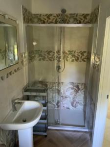 a bathroom with a shower and a sink at Les Chandelles in San Menaio +46 photos