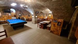 a room with a pool table in a building at Pitvar Vendégház in Zalaegerszeg