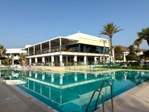 a large swimming pool in front of a building at Parador de Mojácar in Mojácar