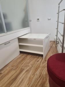 a dressing room with white cabinets and a mirror at Horizon Suite Bellavista in Catanzaro +26 photos