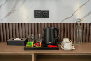 a coffee maker sitting on top of a table at Lagoon Dhigurah in Dhigurah