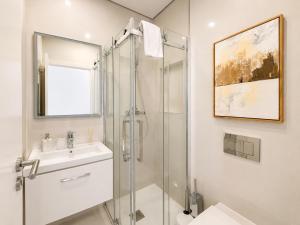 a bathroom with a shower and a sink at Marina Plaza by Garvetur in Vilamoura +64 photos