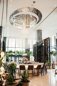 a large dining room with a large chandelier at Four Seasons New Orleans in New Orleans