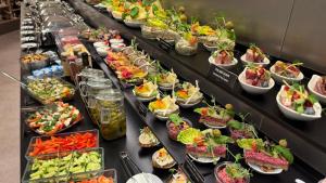 a buffet line with many plates of food at Wellness Hotel Fénix in Liberec