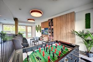 a living room with a large pool table at Wellness Hotel Fénix in Liberec
