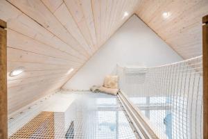 a room with a large window and a net at Modern Comfort - Spa - Mountain - Chalet ALBA in Saint Come