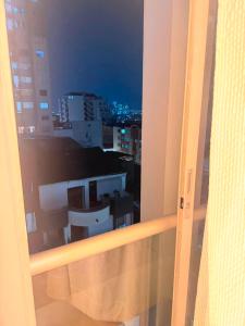 a view of a city at night from a window at Apto Amoblado Luxury in Bucaramanga