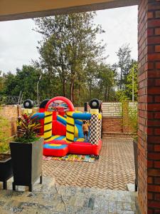 a colorful inflatable playground in a backyard at Mansarda parkview Hotel in Nyagatare