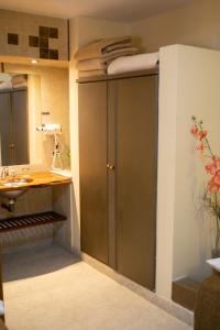 a bathroom with a shower and a sink at Hotel Inkai in Salta +120 photos
