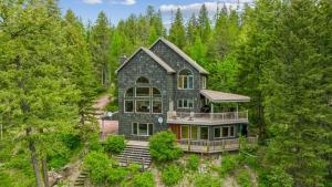 an aerial view of a house in the woods at Elk Run in Whitefish