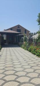 a brick road in front of a building at Village in Oğuz