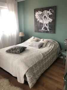 a bedroom with a bed with a picture on the wall at Villa Stella in Montauban +29 photos