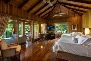 a bedroom with a bed and a living room at Las Lagunas Boutique Hotel in Flores +169 photos